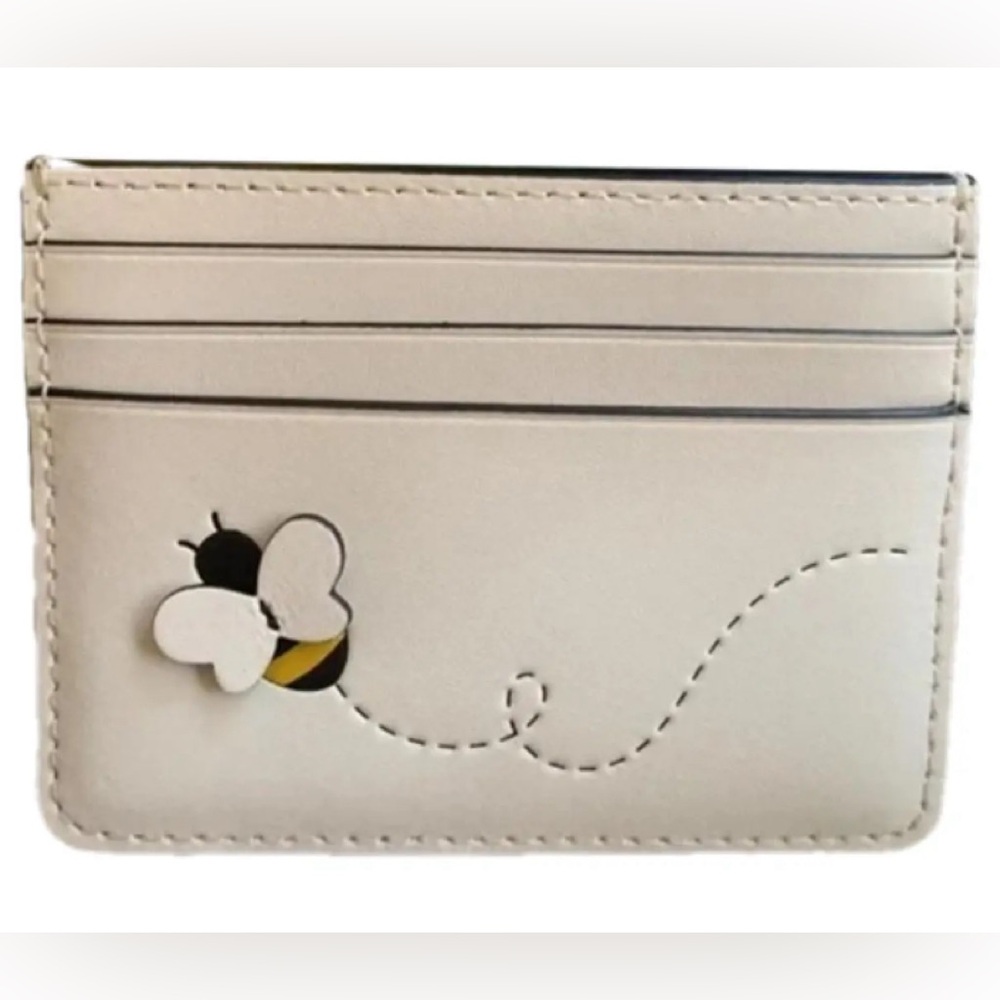 NWOT/NEVER USED KATE SPADE BUTTERFLY CREDIT CARD HOLDER. MSRP $100